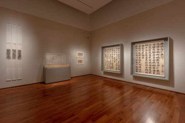 Tao Aimin, In a Twinkle No. 6, 2011, Ink rubbing on paper, set of three hanging scrolls with nushu (women’s script); Xu Bing, Introduction to Square Word Calligraphy (New English Calligraphy), 1994-1996, Calligraphy, ink on paper; Xu Bing, SWC-Sketch for Song of Wandering Aengus Poem by William Butler Yeats, 1999, Calligraphy, ink on paper; XuBing, SWC, Song of Wandering Aengus by William Butler Yeats, 1999, Calligraphy, ink on paper.